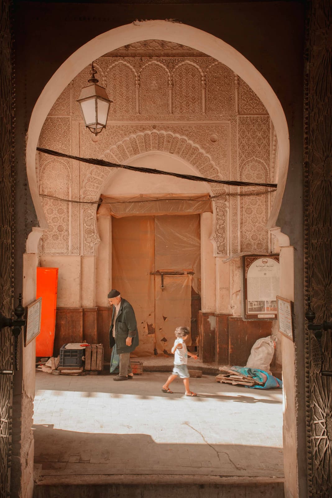 Ornate Moroccan arch framing courtyard