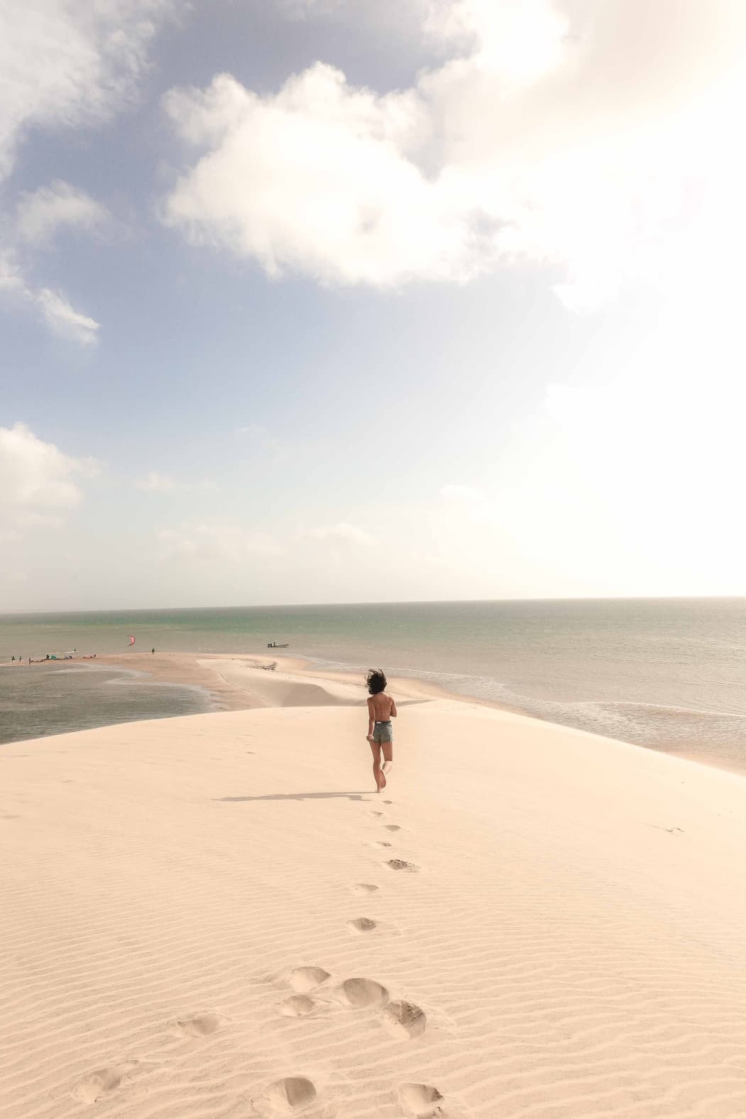 Aerial view of wave meeting sand